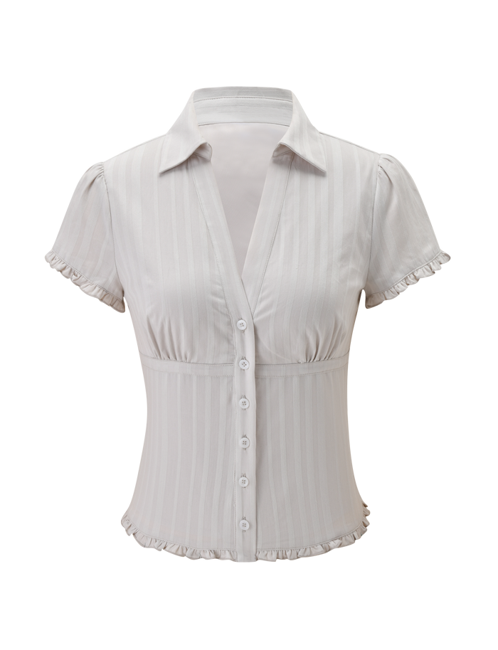 The VALERIE SHORT SLEEVE SHIRT - GREY by TIGERMIST is a grey cotton shirt with short sleeves, a deep V-neckline, fitted waist, subtle vertical stripes, ruffled sleeve edges, and a charming ruffled hem.