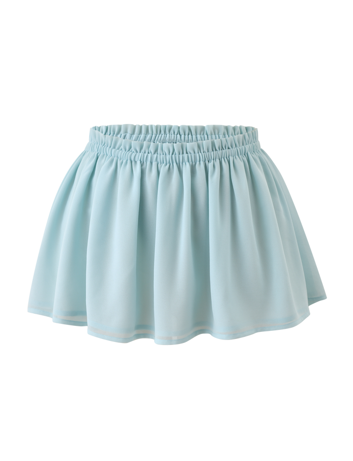 The TIGERMIST VEDA Ruched Mini Skirt in Seafoam features a flounce silhouette with an elastic waistband. Made from soft, flowy fabric for an airy look, this skirt is showcased against a white background.