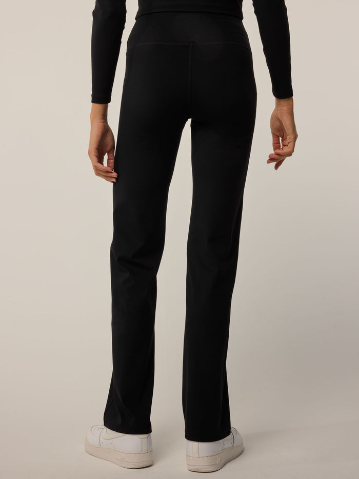 Greyson Clothiers Venus Flare Pant in Black - Back View, Sculpted Flared Leg Silhouette On Model | Greyson Clothiers