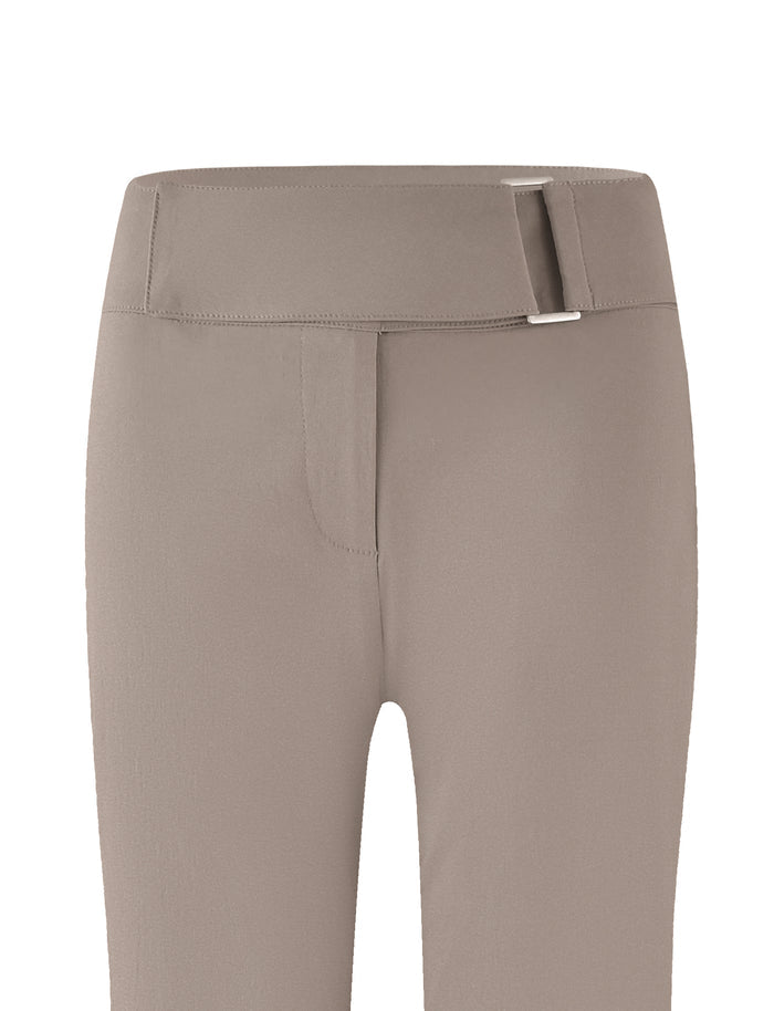 The VESPER PANT - BROWN : TAN by TIGERMIST is a pair of solid tan high-waisted pants featuring a wide waistband with a silver buckle. These pants are fitted and boast a sleek, minimalist design.