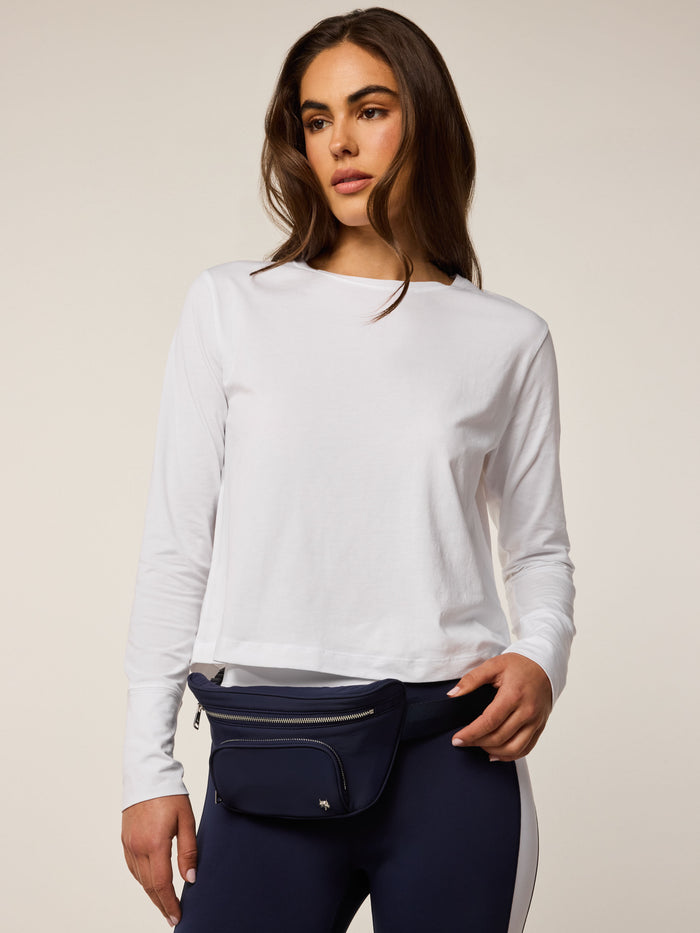 Maltese Blue Wind Cross Body Pack styled as belt bag at hip, dual zip pockets - On Model Waist View | Greyson Clothiers