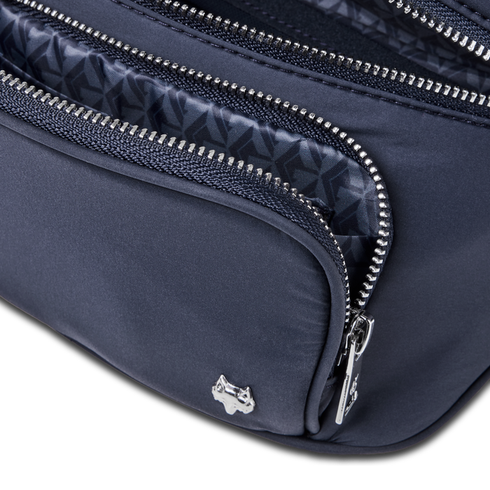 Maltese Blue Wind Cross Body Pack open zipper revealing patterned interior lining and silver wolf logo - Interior Detail | Greyson Clothiers