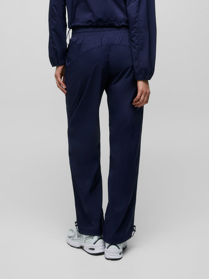 Maltese Blue Women's Wind Jogger Seam & Silhouette Detail - Back View On Model | Greyson Clothiers