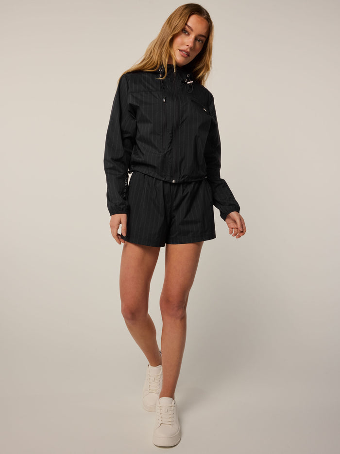 Wind Pinstripe Jacket in black - Full Length View, women's premium golf outerwear styled with matching shorts | Greyson Clothiers