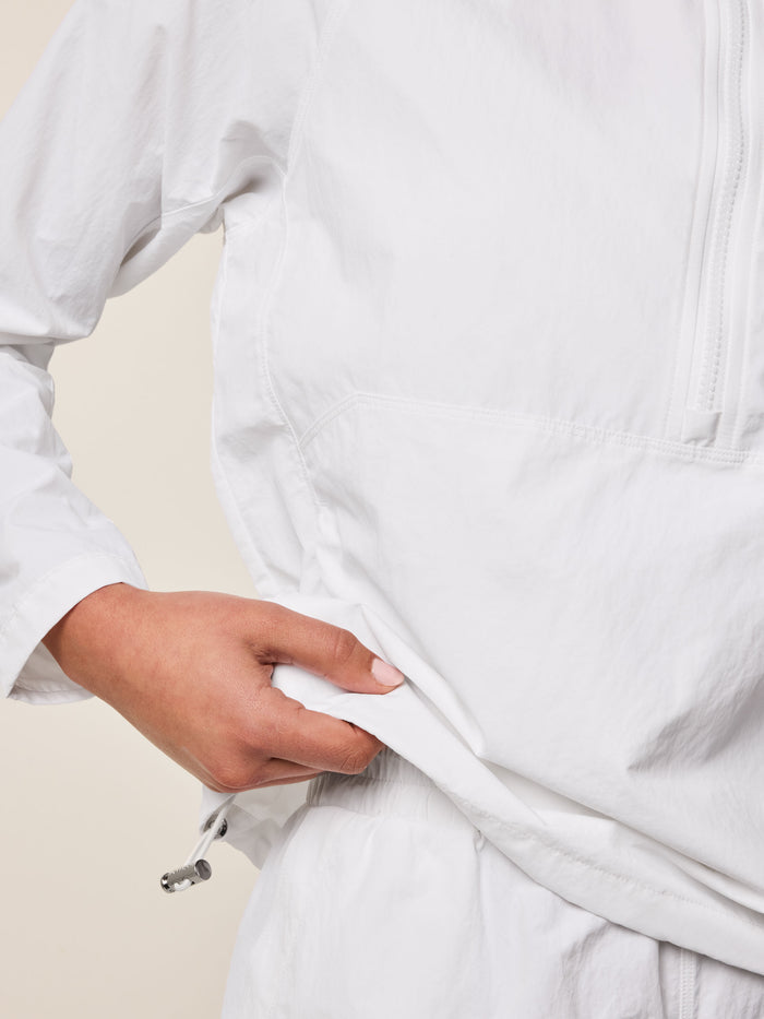 Arctic Women's Windbreaker Jacket - Side Pocket Opening & Drawcord Hem Close-Up | Greyson Clothiers