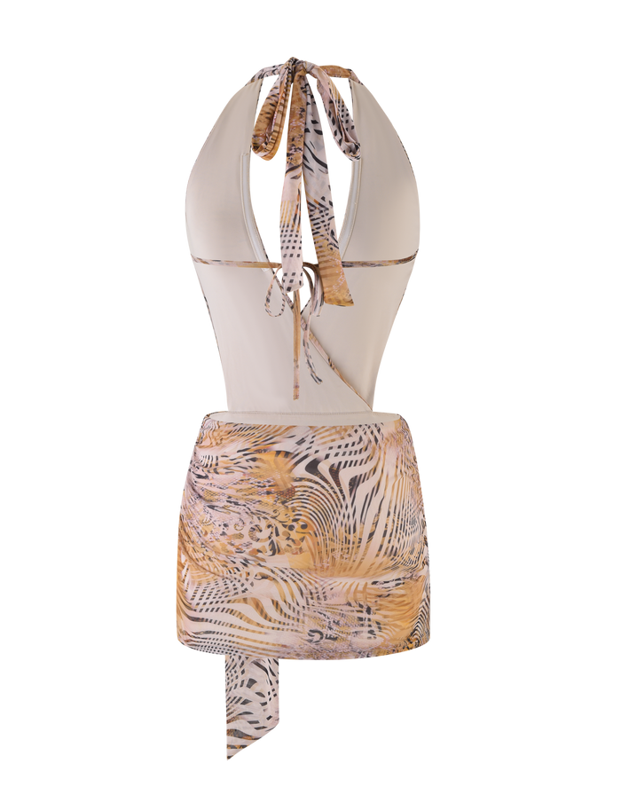 The YARA MINI DRESS - NEUTRAL : ANIMAL : ANIMAL MARBLE by TIGERMIST, a sheer animal print mesh dress in beige, brown, and black, is styled over a halter-neck one-piece swimsuit and shown on a plain white background.