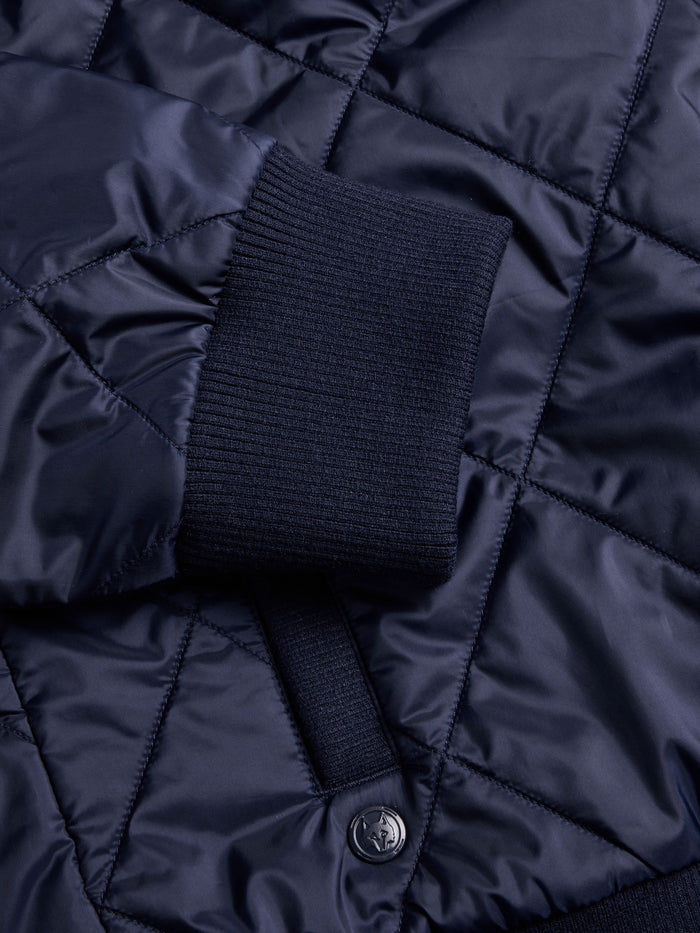 Yukon X-Lite Cardigan Maltese Blue - Ribbed Cuff & Wolf Logo Button Detail, Diamond Quilted Fabric | Greyson Clothiers