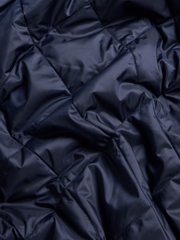 Yukon X-Lite Cardigan Maltese Blue - Diamond Quilted Technical Fabric Texture Close-Up | Greyson Clothiers