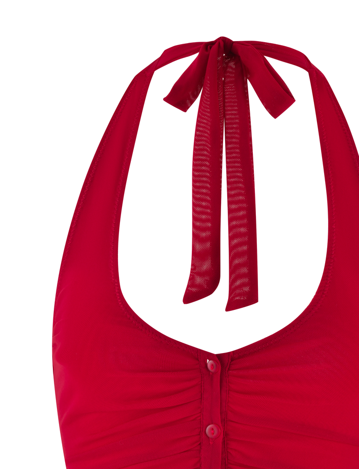 Close-up of the ZAFIRA TOP - RED by TIGERMIST, a vibrant halter-neck style with a deep neckline, gathered placket with buttons, and adjustable tie straps at the neck.