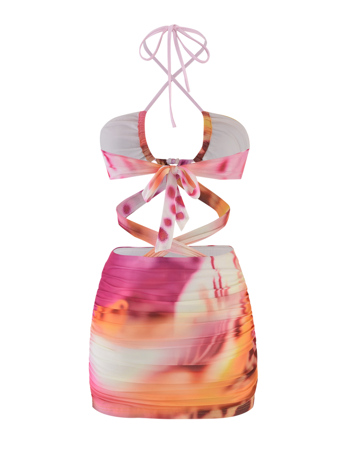 The ZARIAH MINI DRESS - MACRO ORCHID by TIGERMIST is a colorful bodycon mini dress with an abstract pink, orange, and white pattern, featuring front and side cutouts, ruching, adjustable bust panels, and a ribbon tie back.
