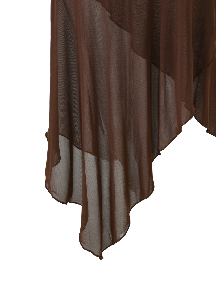 The ZINNIA MIDI SKIRT by TIGERMIST in chocolate features sheer, layered fabric, an asymmetrical flowing hem, and a textured stretch knit waistband, shown against a plain white background.