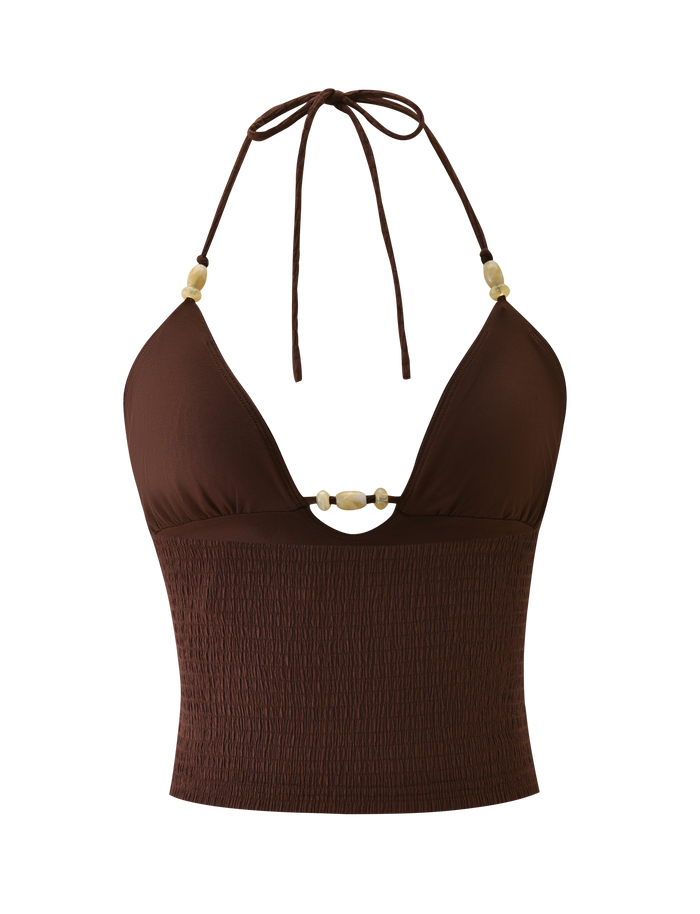 The ZINNIA TOP - CHOCOLATE by TIGERMIST features a smocked bodice, deep V neckline, light decorative beads on straps and center front, and an adjustable halter neck in textured stretchy knit for comfort.
