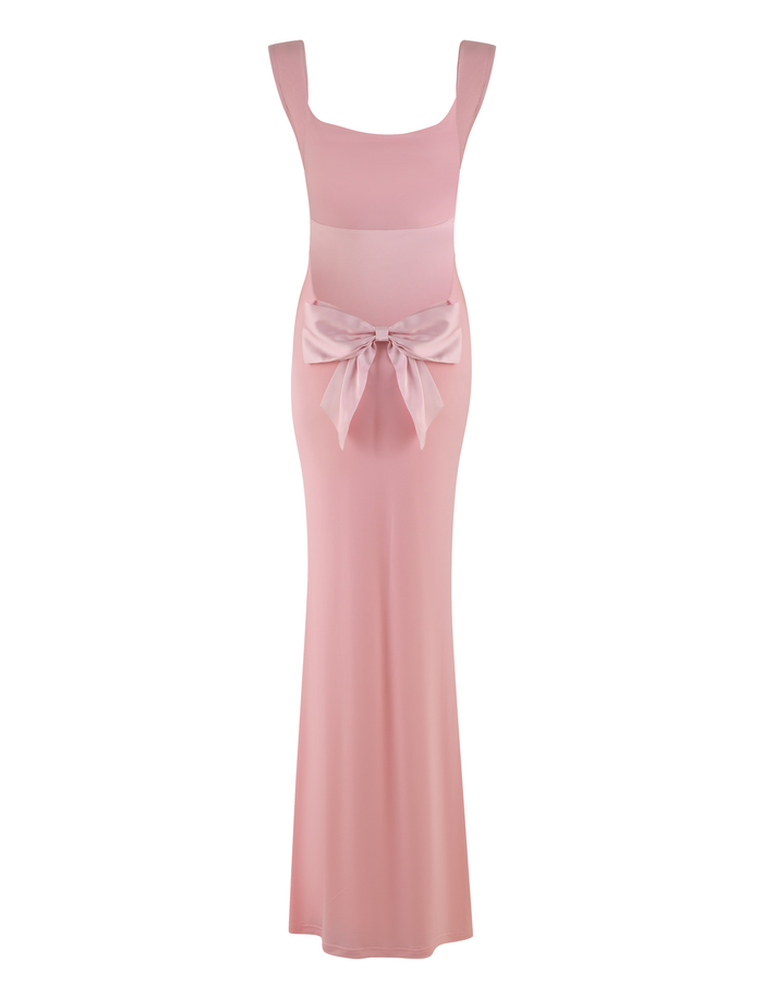 The ZITA DRESS - PINK by TIGERMIST is a maxi-length, sleeveless dress in baby pink, featuring a fitted bodice, wide straps, and a statement front bow—ideal for special occasions.